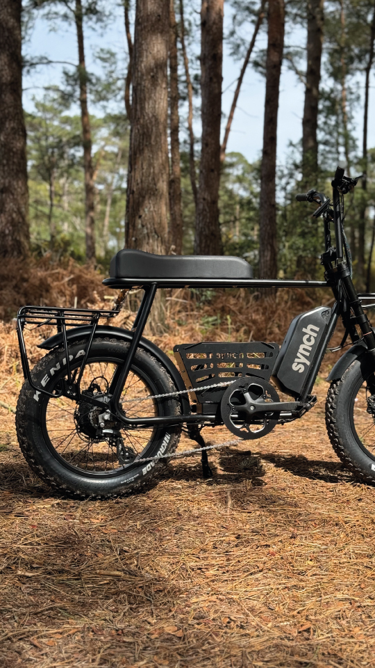 Synch Super Monkey electric bike being used in the woods as an off road electric bike