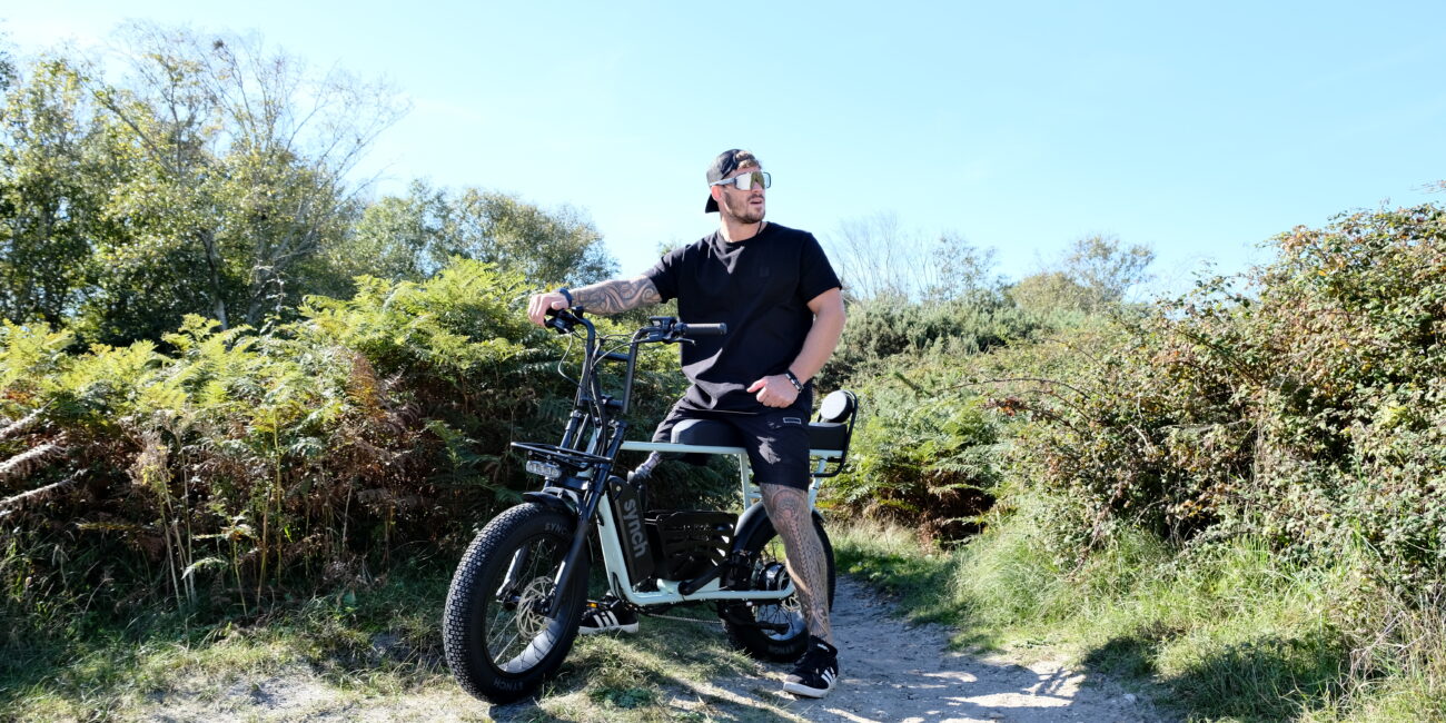 Synch two seater electric bike - the Longtail Monkey being ridden in the countryside. Motorbike Style Ebike.